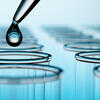 image of liquid going into a beaker